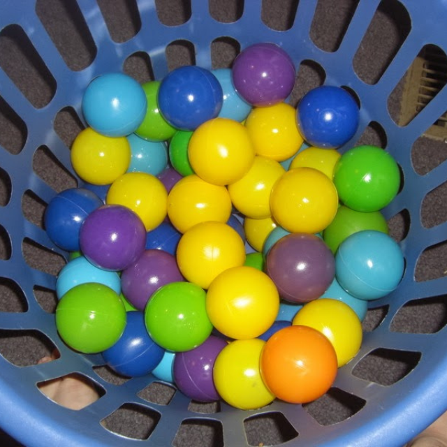 A basket of ball pit plastic balls