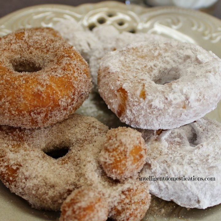 Biscuit doughnuts with powdered sugar and cinnamon sugar