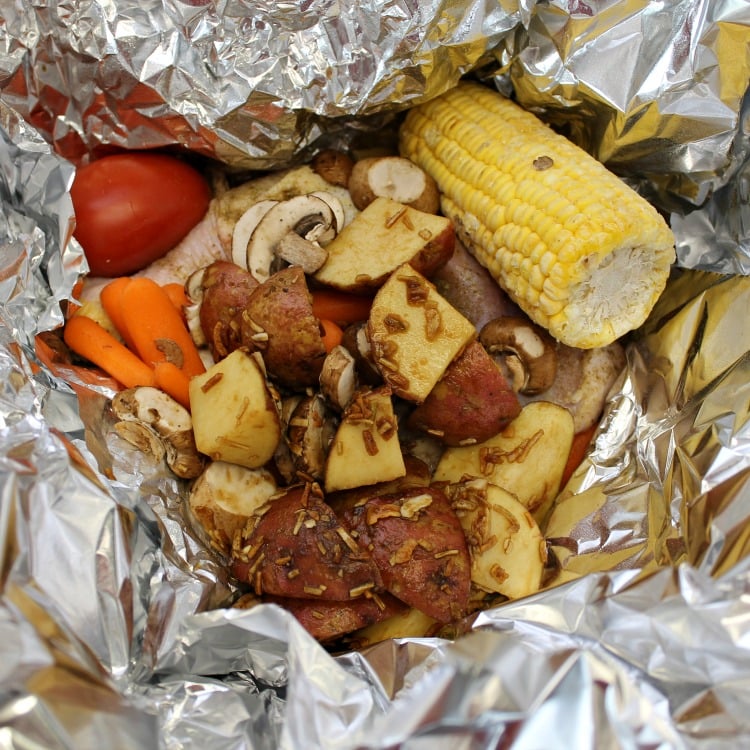 How to make a Foil Pack Chicken Dinner at home. Our Foil packet Chicken Dinner recipe was inspired by Cracker Barrel. You can make this easy dinner recipes in the oven at home or on the grill at home or camping. #foilpack #foilpacketmeal #Chickenrecipe #campingfood