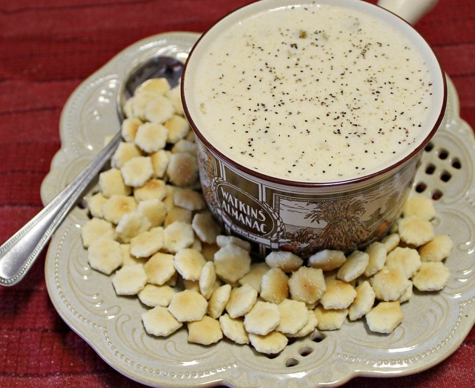 Crab stew served in a soup bowl with oyster crackers