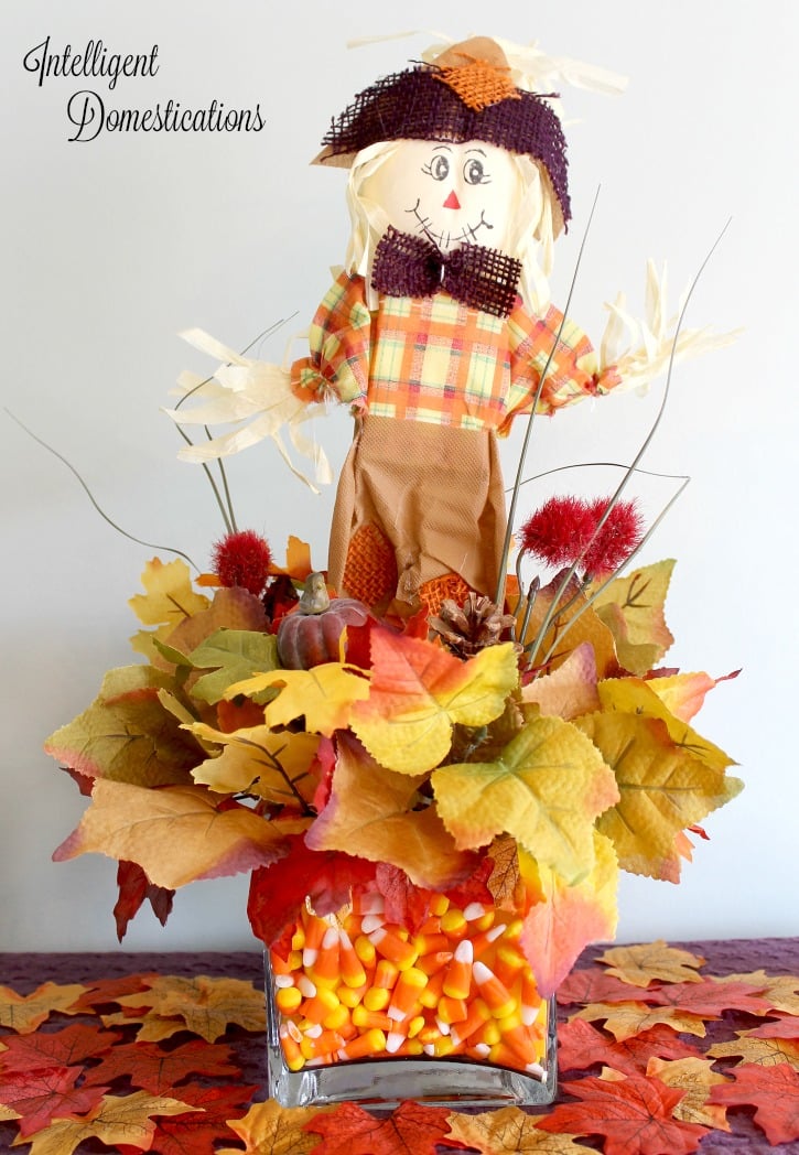 DIY Scarecrow Table Decor Dollar Store Craft. How to make this cute Scarecrow ceenterpiece using Dollar Tree supplies. #Scarecrow #falltabledecor