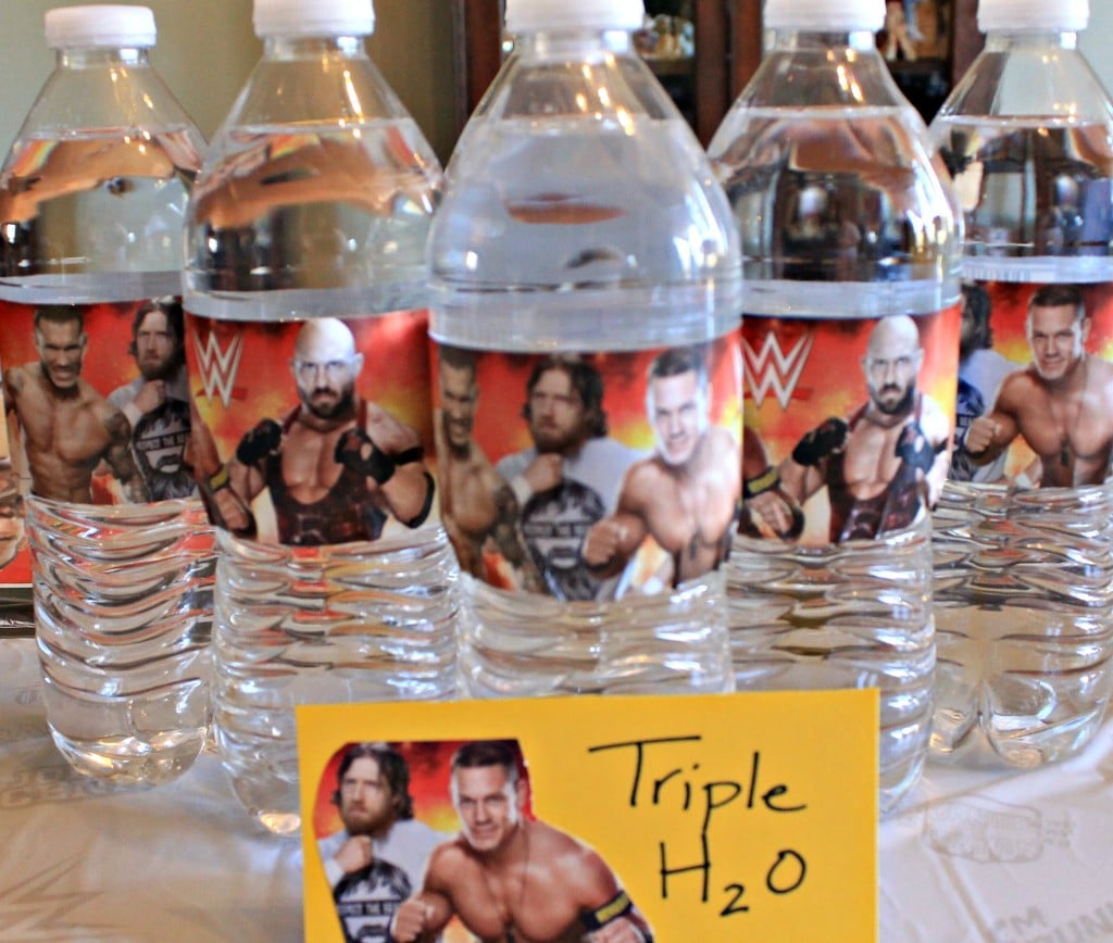 Planning a Wrestlemania party is always the most fun. With WWE Pun Named party food and drinks, we know the menu will be yummy. This is one of our Wrestlemania parties with all the food and decor ideas. #WWEparty WWE Theme Party Ideas with recipes and decor. WWE Party. Serve your guests some Triple H2O at your WWE Theme party.intelligentdomestications.com