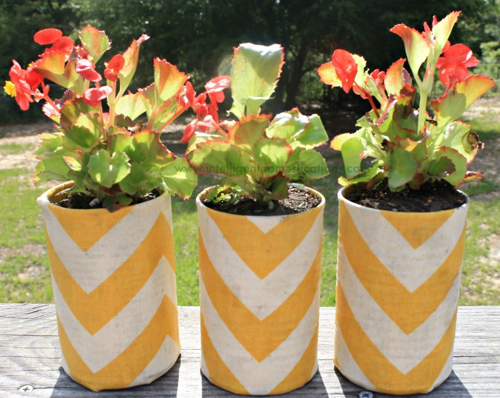 Mod Podged Chevron fabric covered cans become flower pots.www.intelligentdomestications.com