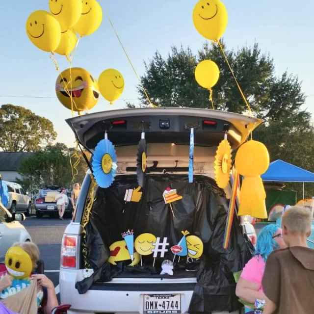 Smiley face emoji Trunk or Treat design in the back of a car.