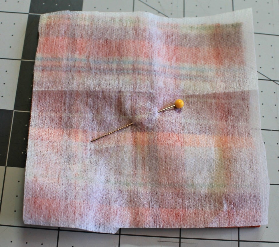 Pin the interfacing in place and sew the edges