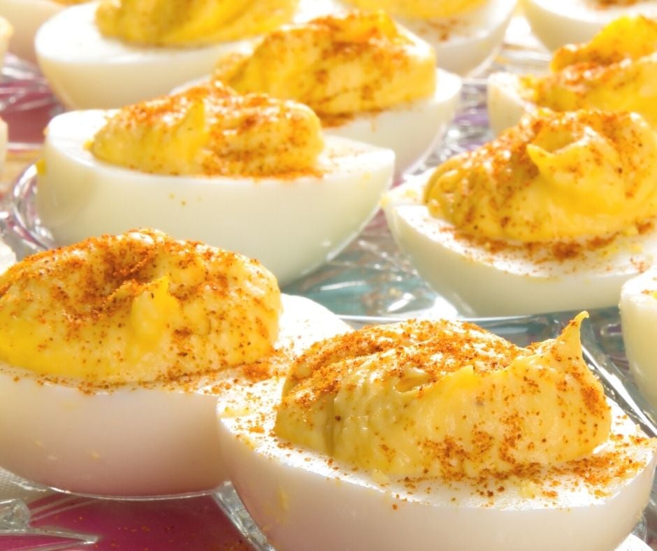 deviled eggs with paprika sprinkled on top