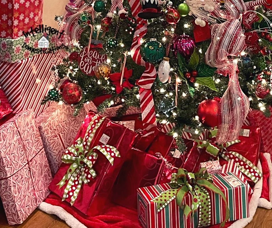Gifts wrapped under a Christmas tree in paper that matches the tree decorations