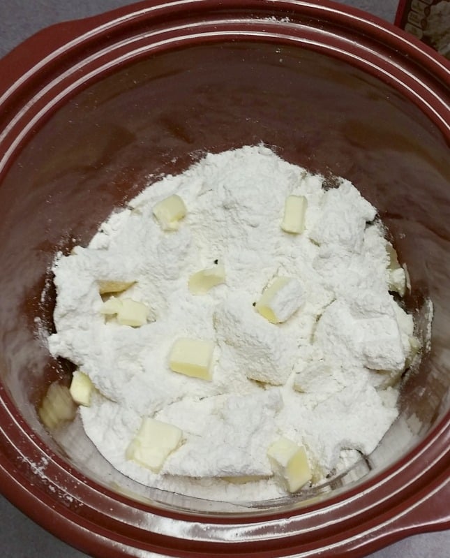 Layer the ingredients in the crockpot for your 3 Ingredient Crockpot Apple Dumplings easy recipe at intelligentdomestications.com