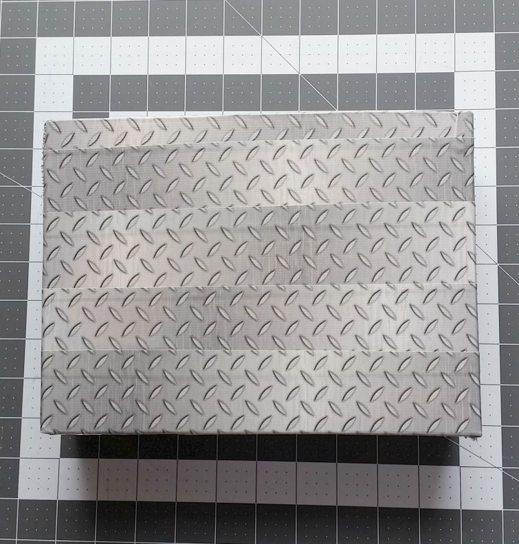 Continue wrapping with duct tape to cover the outside