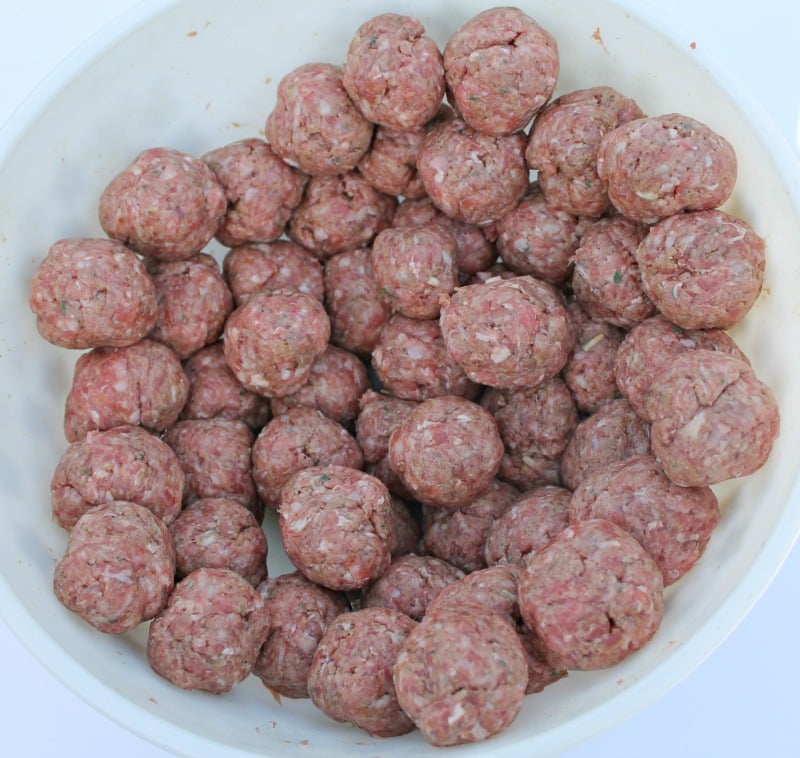 fresh homemade meatballs in a bowl waiting to be frozen or cooked