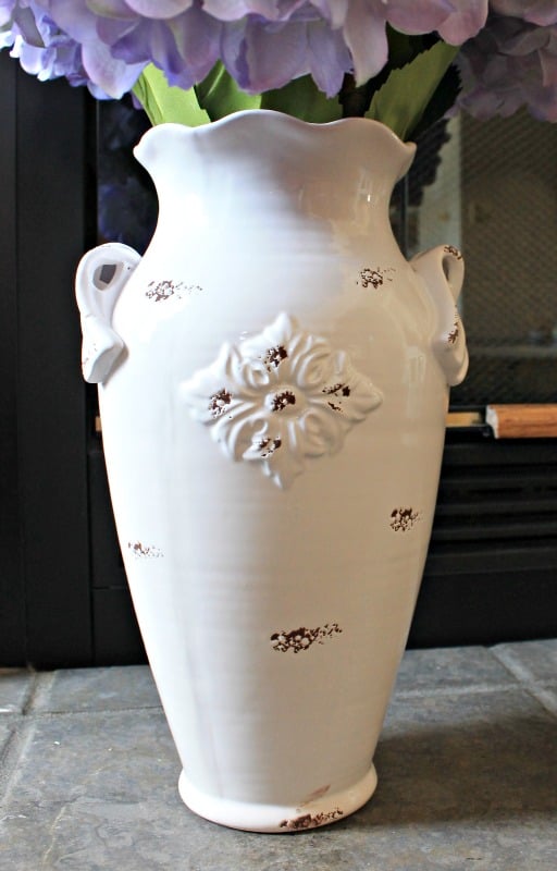 White chippy porcelain vase from the At Home store is the perfect piece for a bunch of giant purple hydrangea