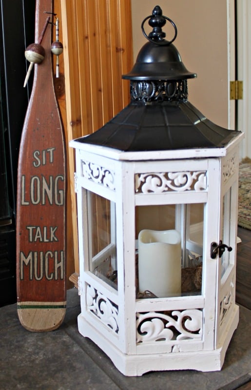 White wood with metal roof hex gazebo lantern used for fireplace decor