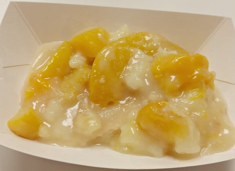 Buckner's Famous Peach Cobbler served in their little paper bowls already on the lazy susan table for your convenience