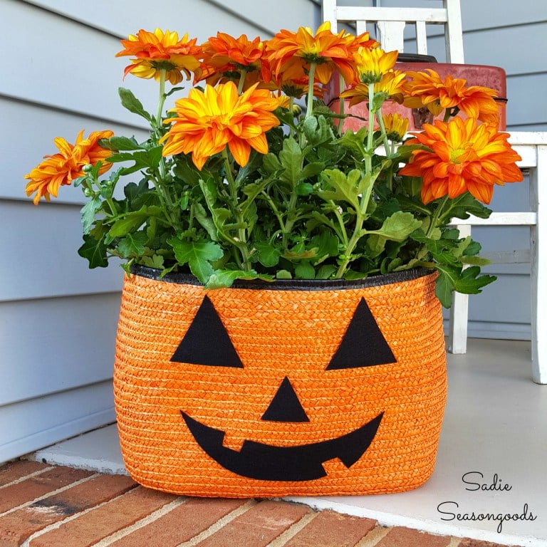 7_orange_black_straw_tote_bag_to_be_repurposed_as_halloween_pumpkin_jack_o-lantern_porch_planter_for_pele_mums_by_sadie_seasongoods