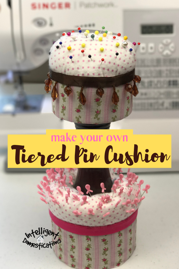Use some scrap fabric and a couple of cans to make a Two Tier Sewing Pin Cushion for your sewing room or craft room. A nice upcycle project for the craft room. Easy tutorial. #craftroom #sewingroom #repurpose #upcycle #intellid #craftroomstorage