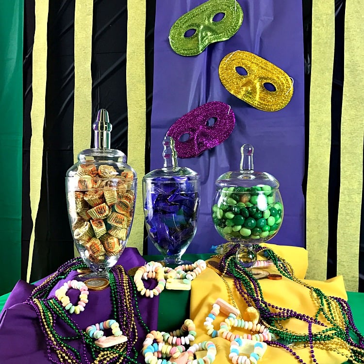 Mardi Gras Party Ideas. Family Friendly Mardi Gras Party Ideas. How to style candy glass jars for a party. Photo of a candy buffet. Mardi Gras Candy Buffet.