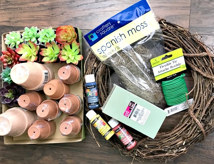 craft supplies for making a clay pot wreath. flower pots and faux succulents, grapevine wreath and other wreath making supplies