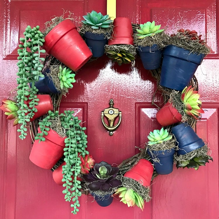 DIY Clay Flower Pot Wreath Tutorial. Make this succulent wreath using painted clay flower pots. #diywreath