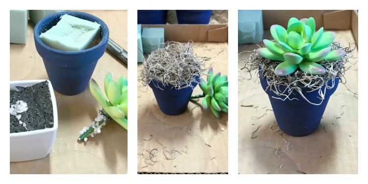 a small clay flower pot painted blue with succulents being added to it