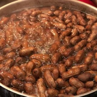 How To Make Boiled Peanuts. It's a very simple recipe involving only 3 ingredients and one of those is water. Boiled peanuts are football food, baseball food, an appetizer or snack and even a good party food. You can cook boiled peanuts on your stove top at home! #footballfood #appetizer #boiledpeanuts