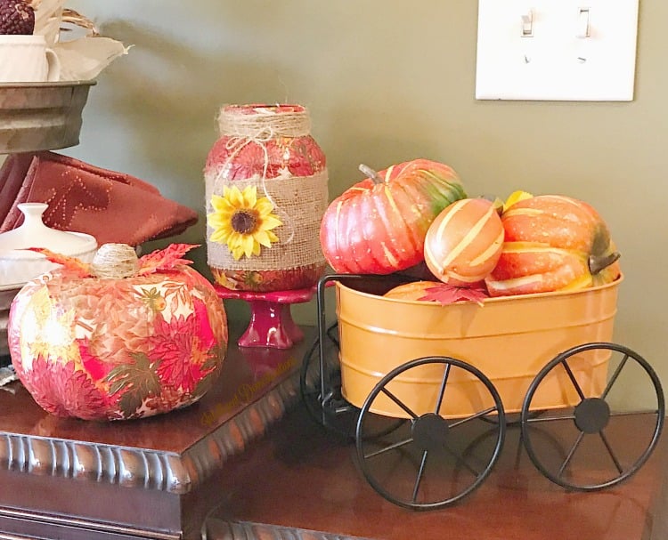 A fall decor vignette with pumpkins