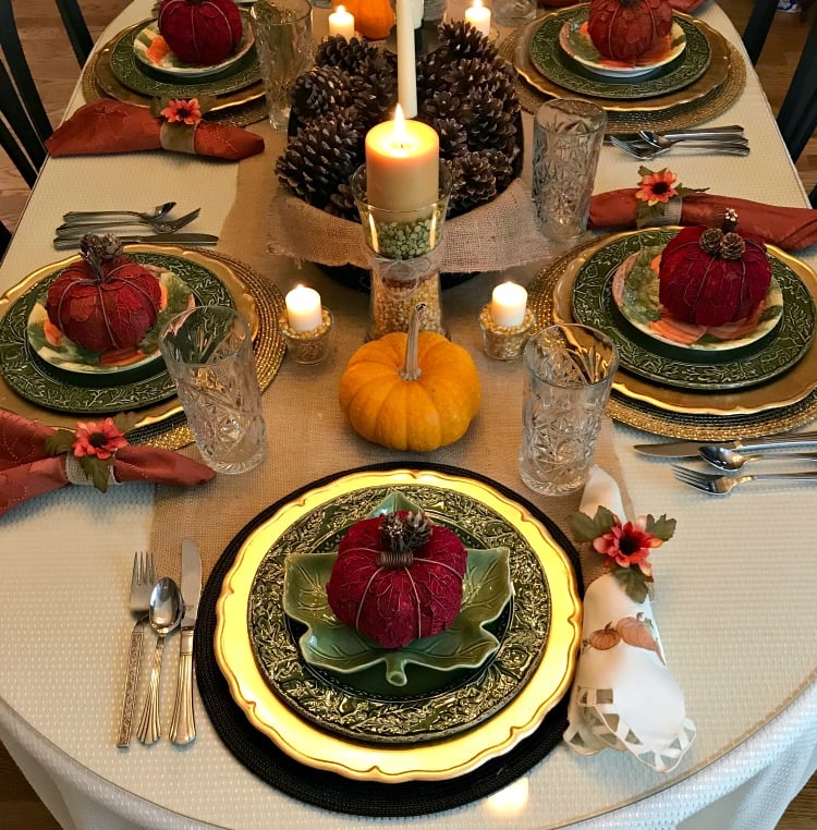Thanksgiving Tablescape using Gold and Green, Pinecones, Pumpkins, Glass and Natural elements.