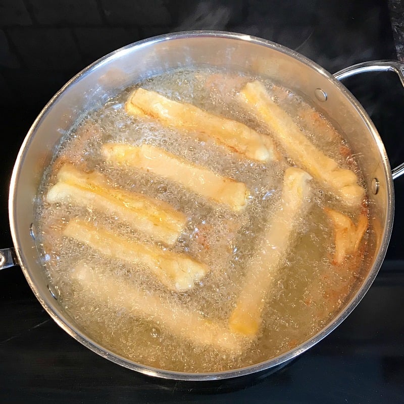 How to make Grilled Cheese fries using Crescent Rolls and process cheese like Velveeta. The deep fried Grilled Cheese fries are a delicious appetizer for Game Day or any party. #partyfood #appetizer #friedcheese