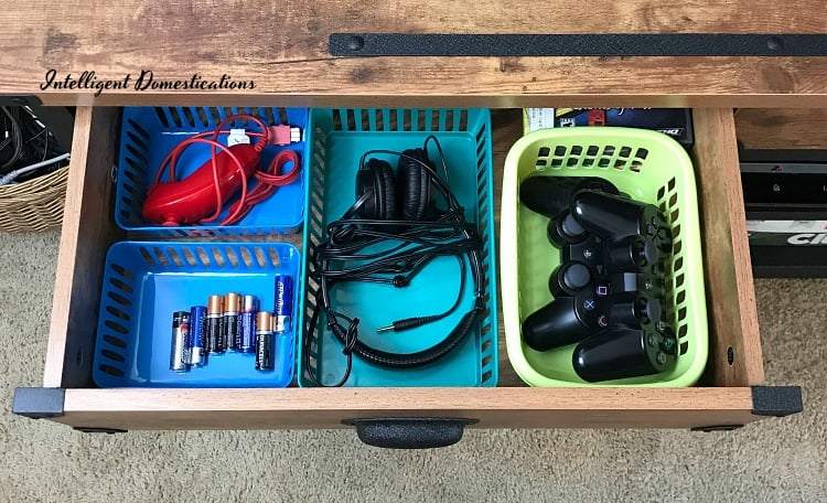 Using drawers to organize game system accessories and supplies. How I organized our game system accessories with drawers on a TV console. #howtoorganize 
