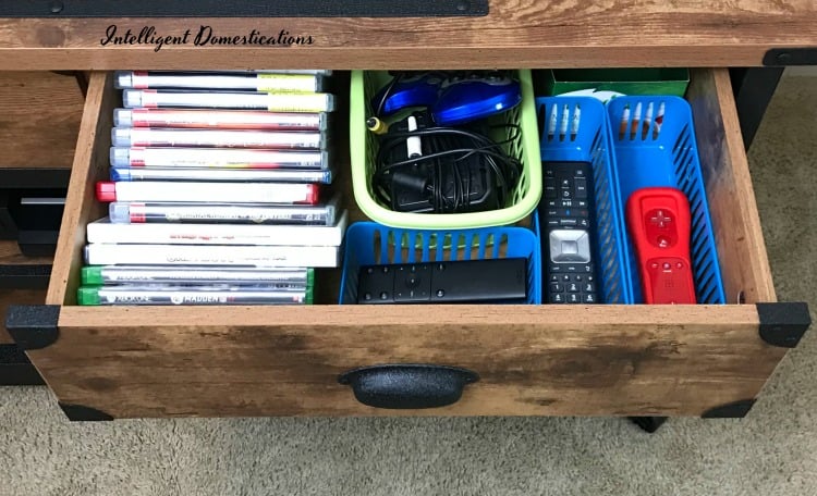 Using drawers to organize game system accessories and supplies. How I organized our game system accessories with drawers on a TV console. #howtoorganize 