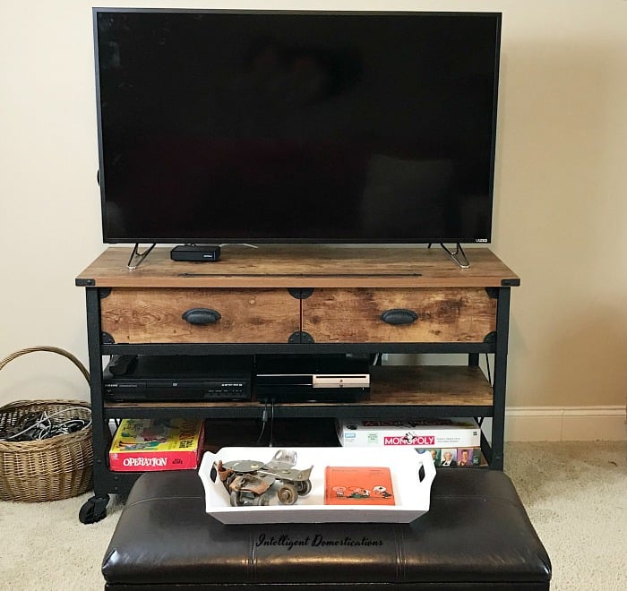 Using drawers to organize game system accessories and supplies. How I organized our game system accessories with drawers on a TV console. #howtoorganize 