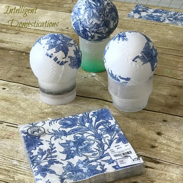 Make your own Blue and White Orbs using napkins, Wiffle balls and decoupage. See how easy it is. DIY Orbs for home decor. How to make your own Orbs for staging bowls and trays. #diy #makeyourown #diyorb #diyblueandwhitedecor #howtostageabowl #homedecor