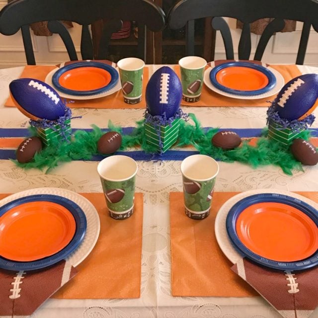 This Auburn color scheme football party table was created for a teen birthday celebration. These colors and ideas can be used for any team with Blue and Orange colors. Sports theme birthday party ideas. Blue and Orange Football Party Table Decor. SEC Football Party. #footballparty #blueandorangeparty #teenboyparty #teenbirthday #sec #Auburnparty #homegating #dollarstore #sporttheme #teamcolors SEC Auburn Football Tablescape. Blue and Orange Football Party Table Decor.