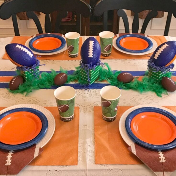 This Auburn color scheme football party table was created for a teen birthday celebration. These colors and ideas can be used for any team with Blue and Orange colors. Sports theme birthday party ideas. Blue and Orange Football Party Table Decor. SEC Football Party. #footballparty #blueandorangeparty #teenboyparty #teenbirthday #sec #Auburnparty #homegating #dollarstore #sporttheme #teamcolors