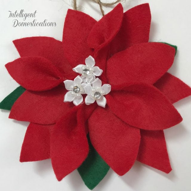 How To Make A Felt Poinsettia Ornament for your Christmas tree. These are super easy and affordable making them a perfect gift to give or keep them for yourself. #poinsettia #DIYornament #Feltcraft How To Make A Felt Poinsettia Ornament for your Christmas tree. These are super easy and affordable making them a perfect gift to give or keep them for yourself. #poinsettia #DIYornament #Feltcraft