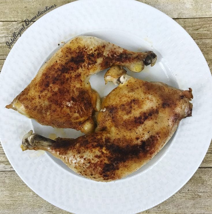 This is the recipe for Baked Chicken Leg Quarters I have always used. There are only 6 ingredients which you already have on hand. This dish is oven ready in under an hour for a crispy tender weeknight meal. #chickenrecipe 2 Baked Chicken Leg Quarters on a white dish