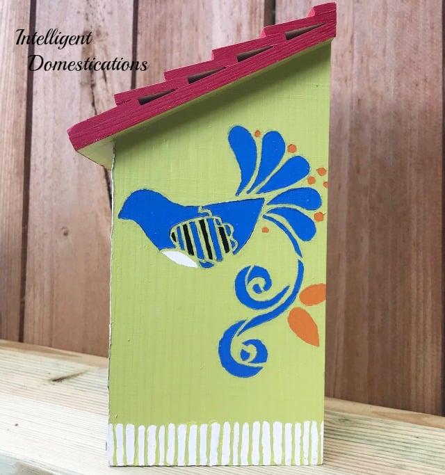 Painting Birdhouses is a fun and easy birdhouse craft for any time of the year. We have painted a whole collection of decorative birdhouses for a new fence shelf in our backyard to invite more birds to stop by. You will find several here along with the stencil and paint colors we are using for our outdoor decor. #birding #birdhouse Painting Birdhouses is a fun and easy birdhouse craft for any time of the year. We have painted a whole collection of decorative birdhouses for a new fence shelf in our backyard to invite more birds to stop by. You will find several here along with the stencil and paint colors we are using for our outdoor decor. #birding #birdhouse