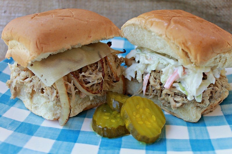 Chicken slider sandwiches with pickles on a plaid plate