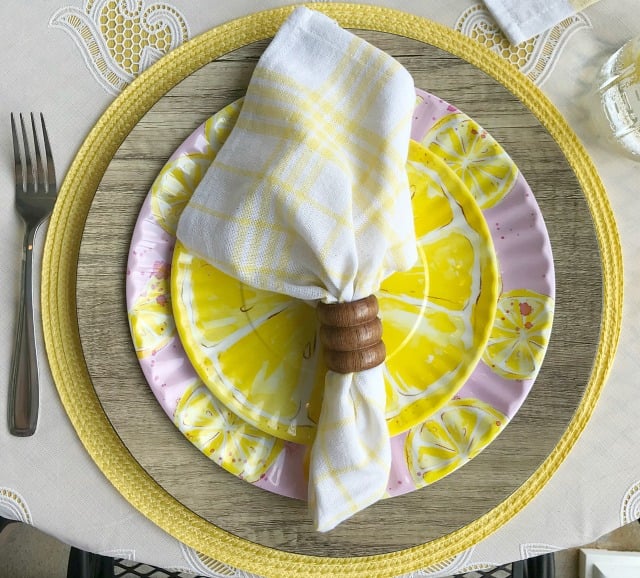 We created this Simple Lemon Tablescape for a late summer romantic soiree for two. My table decorations are simple and Mason Jars were perfect for our lemon infused water. Yes, those are Melamine dishes found! #lemontablescape #yellowtablescape #tabledecorations
