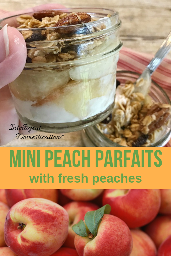 Small Mason jars displaying peach parfait being held in a hand and sitting on a table with a red ticking color towel and a bunch of fresh peaches nearby
