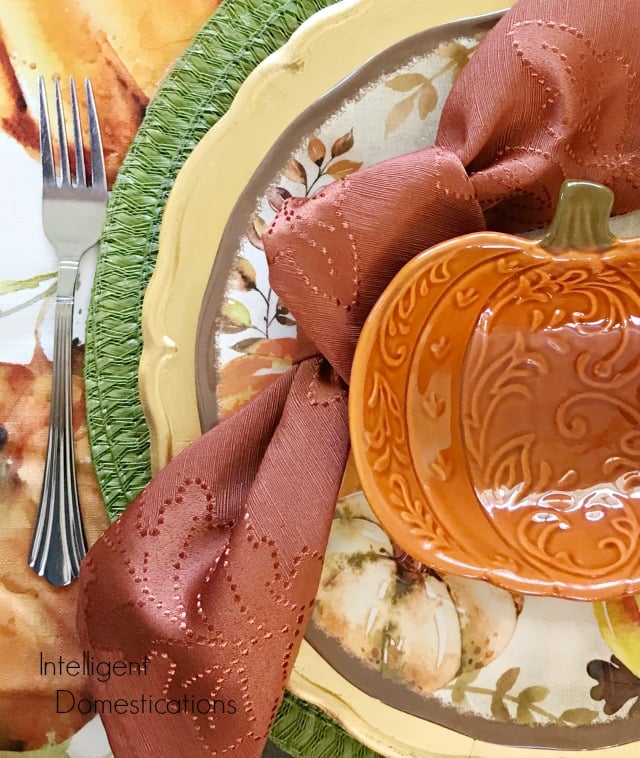 Fall Table decor ideas using everyday dishes and elements from nature. Pine cones make a nice centerpiece for a Fall Tablescape. Melamine dishes and a clearance Tablecloth bring it all together. #tabledecor Fall Table decor ideas using everyday dishes and elements from nature. Pine cones make a nice centerpiece for a Fall Tablescape. Melamine dishes and a clearance Tablecloth bring it all together. #tabledecor