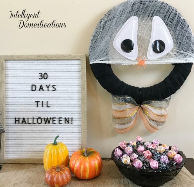 You can make this Silly Spider Web Halloween Wreath in minutes using Dollar store supplies. He is afraid of spiders which is funny since he's a spider web! #HalloweenWreath 