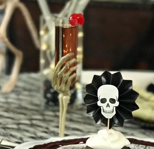 Halloween Skeleton Tablescape. This Halloween Table decor is all decked out in skulls and bones using black white and cream as the focal color scheme. If spooky Halloween is what you are after this one is spooky and creepy. Halloween Skeleton Tablescape. This Halloween Table decor is all decked out in skulls and bones using black white and cream as the focal color scheme. If spooky Halloween is what you are after this one is spooky and creepy.