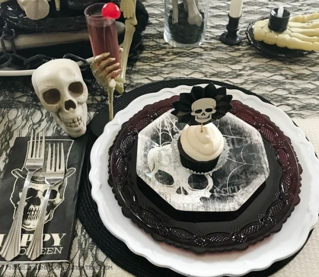 Halloween Skeleton Tablescape. This Halloween Table decor is all decked out in skulls and bones using black white and cream as the focal color scheme. If spooky Halloween is what you are after this one is spooky and creepy. Halloween Skeleton Tablescape. This Halloween Table decor is all decked out in skulls and bones using black white and cream as the focal color scheme. If spooky Halloween is what you are after this one is spooky and creepy.