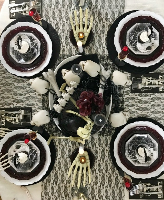 Halloween Skeleton Tablescape. This Halloween Table decor is all decked out in skulls and bones using black white and cream as the focal color scheme. If spooky Halloween is what you are after this one is spooky and creepy. Halloween Skeleton Tablescape. This Halloween Table decor is all decked out in skulls and bones using black white and cream as the focal color scheme. If spooky Halloween is what you are after this one is spooky and creepy.