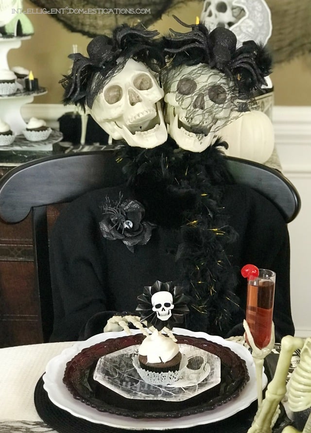 Halloween Skeleton Tablescape. This Halloween Table decor is all decked out in skulls and bones using black white and cream as the focal color scheme. If spooky Halloween is what you are after this one is spooky and creepy. Halloween Skeleton Tablescape. This Halloween Table decor is all decked out in skulls and bones using black white and cream as the focal color scheme. If spooky Halloween is what you are after this one is spooky and creepy.