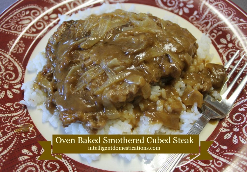 Cube steak and gravy on a bed of rice