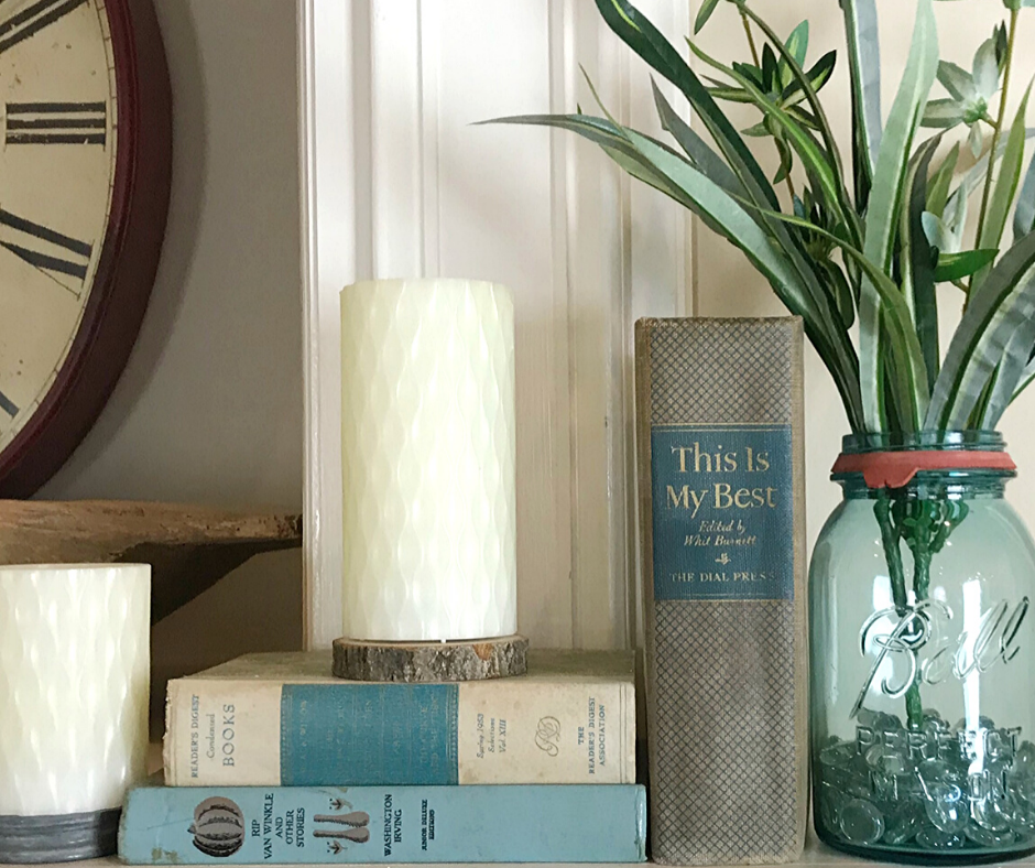 Tips for Decorating a Spring Mantle with plants, candles, old books and greenery. I used what I had on hand to create a simple Spring Mantlescape