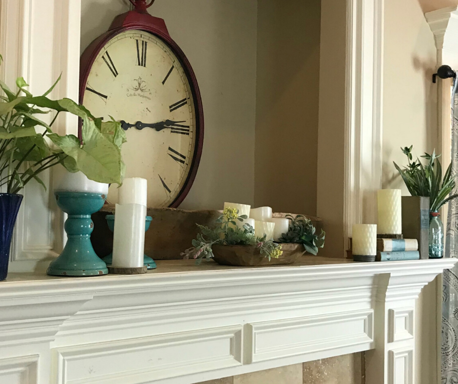 Simple and cheap Spring Mantle decor ideas. I used what I had on hand to create a Spring mantle with candles, books and greenery.
