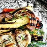 Grilled Pork Chops rubbed with fresh herbs. Bone in. Easy summer grilling recipe for a quick weeknight meal. #grilledporkchops #porkchops #summergrilling