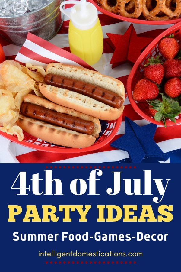 Hotdogs and summer food on a red white and blue decorated table for 4th of July